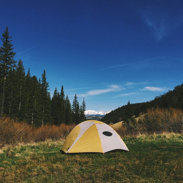 How to plan a camping trip that includes visits to UK national parks?